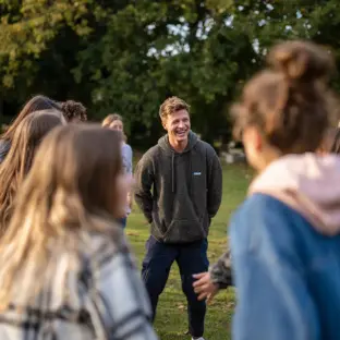 Teenagers participating in an outdoor group therapy session