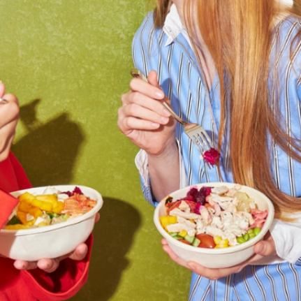 People eating healthy salad bowls
