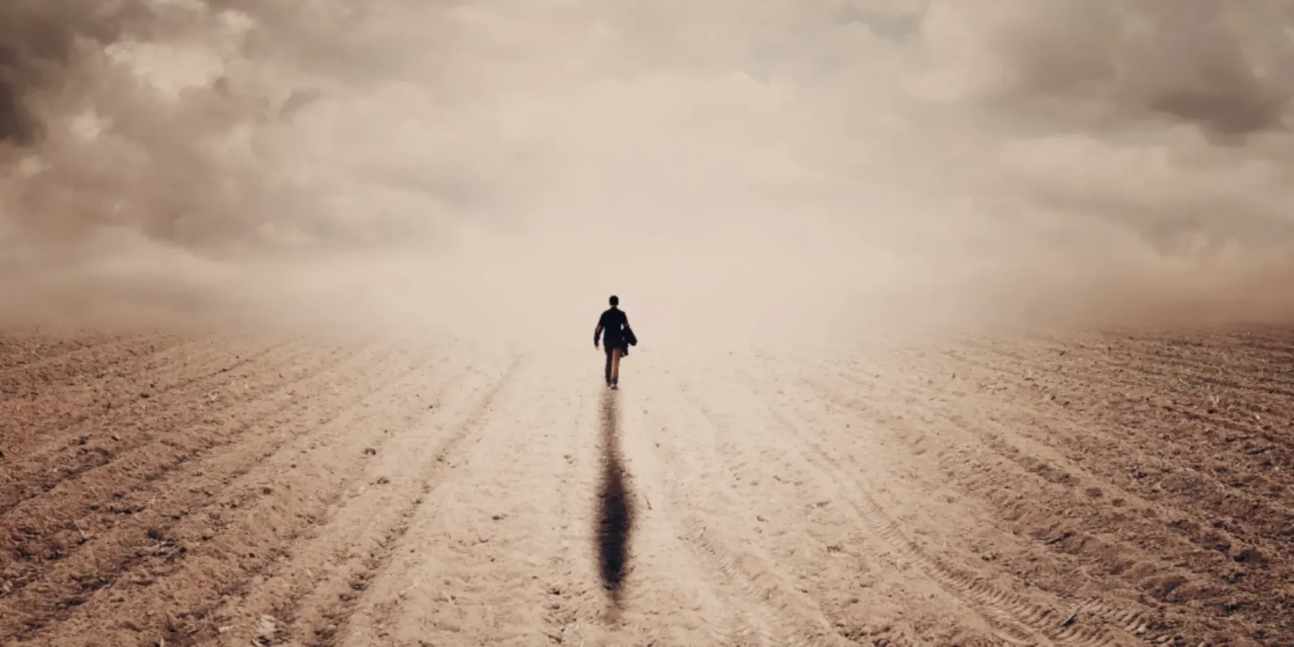 Person walking alone in desert