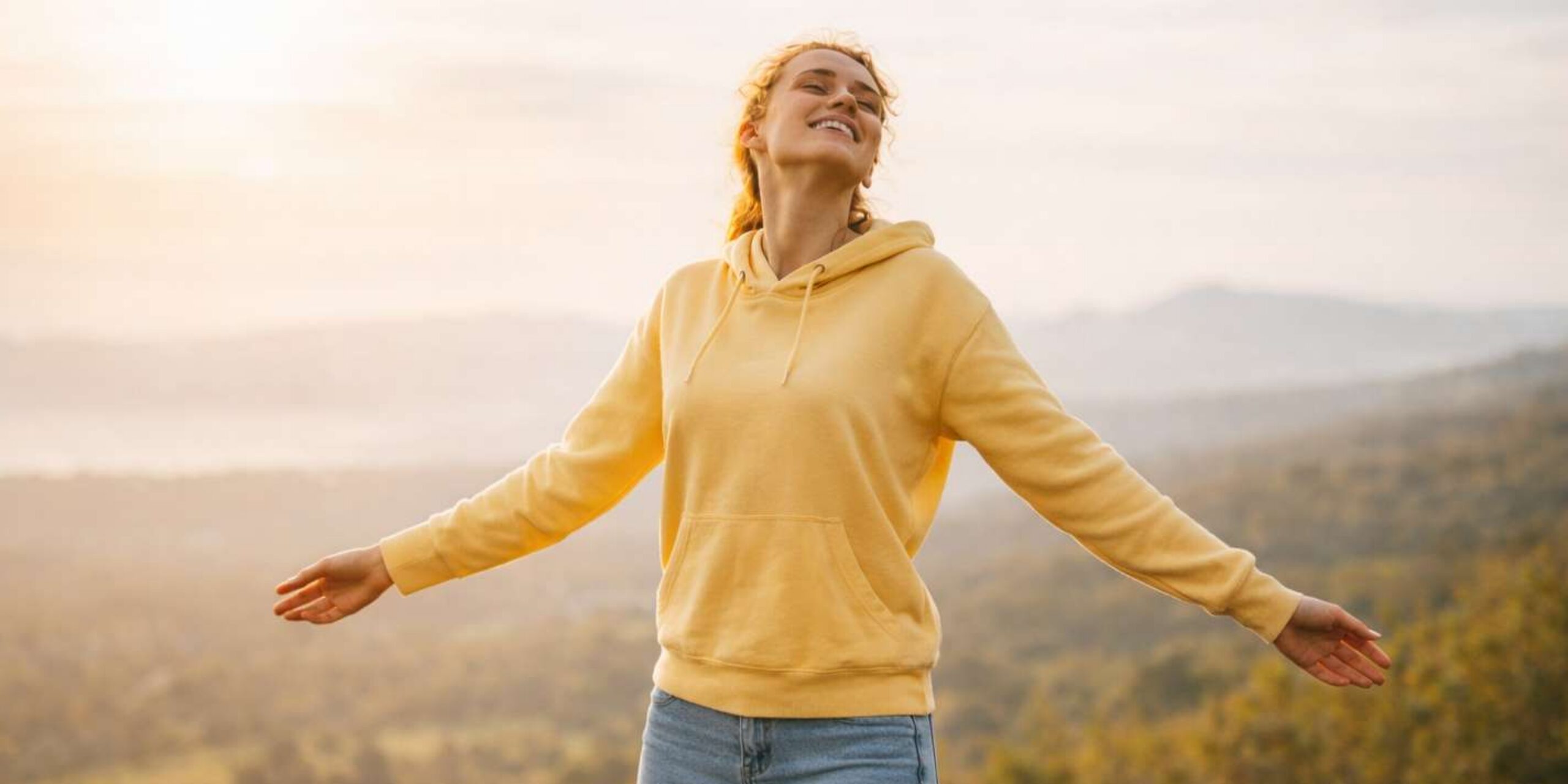 Young woman enjoying fresh air outdoors