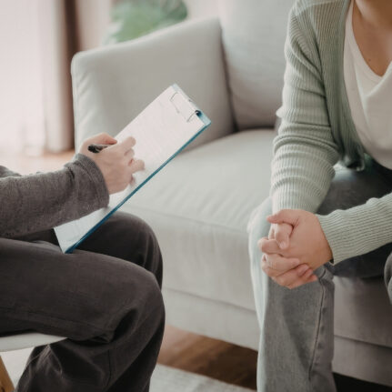 Therapist taking notes during session