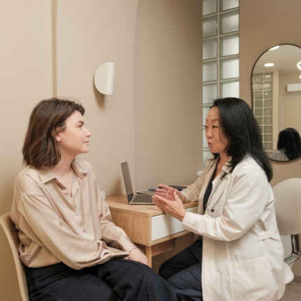 Doctor consulting patient in clinic