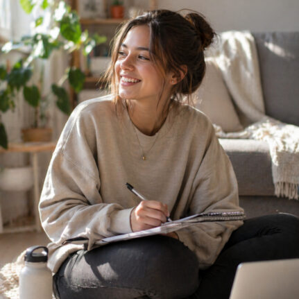 Young woman journaling in sunlight